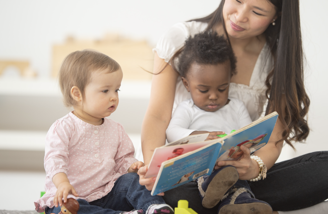 Teacher reading to toddlers Teacher reading to toddlers